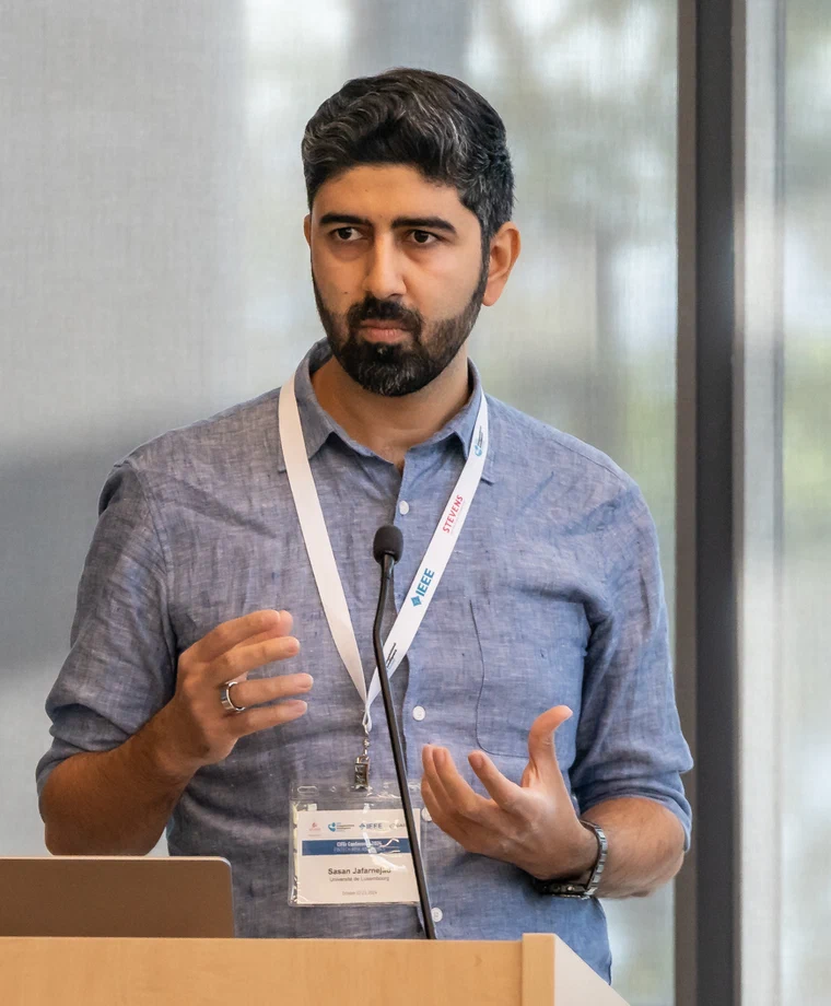 Sasan Jafarnejad speaking at a conference